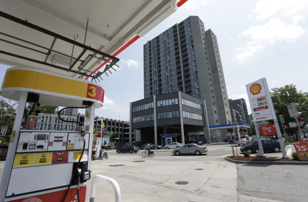 View from the Shell station of the Mobile station and apartment building where Meng's partner, Stephen Silva, and Robel Phillipos held addresses.